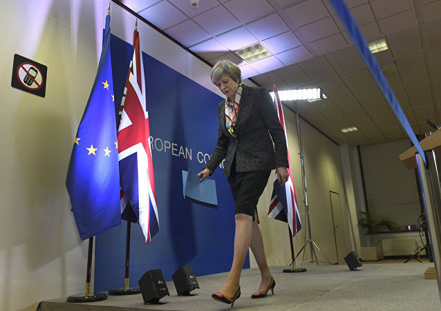 British Prime Minister Theresa May leaves after a press conference during a European Summit