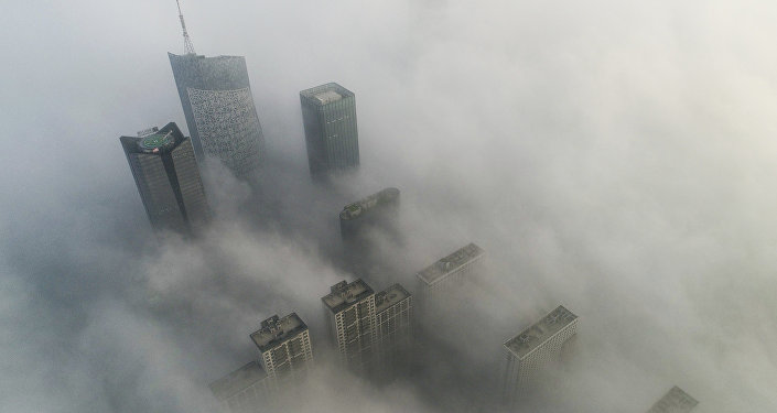 Skyscrapers are shrouded in fog in Hefei in eastern China's Anhui province Skyscrapers are shrouded in fog in Hefei in eastern China's Anhui province
