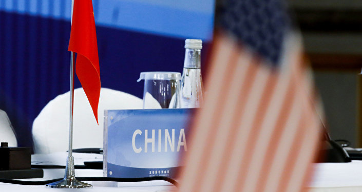 The Chinese and U.S. national flags are seen before the start of a P5 NPT conference in Beijing